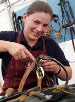 Helen Reader working on a bridle